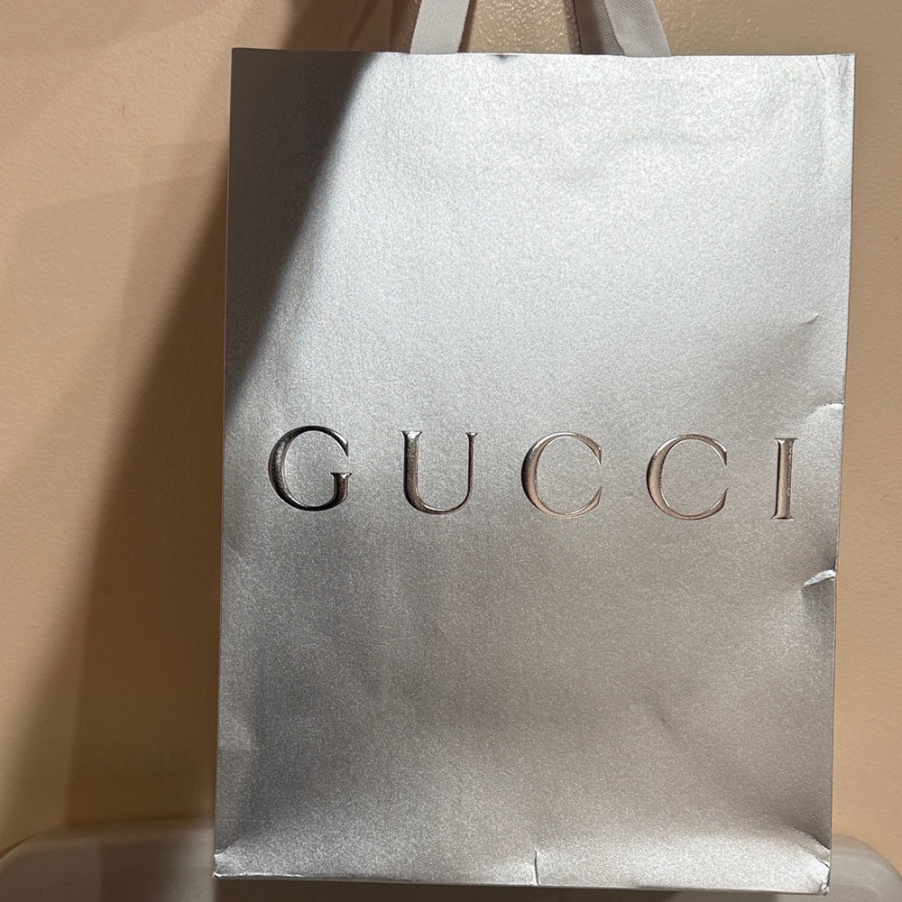 Metallic Silver Shopper Bag with Embossed Logo and White Handles